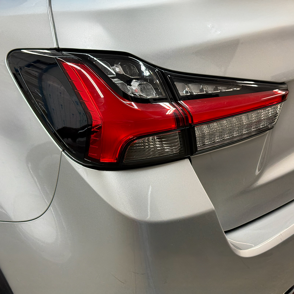 Crux Moto Tail Light Side Tint Vinyl Overlay – Dark Smoke 20% | Precision Fit for Mitsubishi Outlander Sport 2020 +